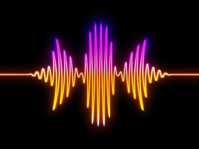 A colorful sound wave graphic with pink and orange hues against a black background.