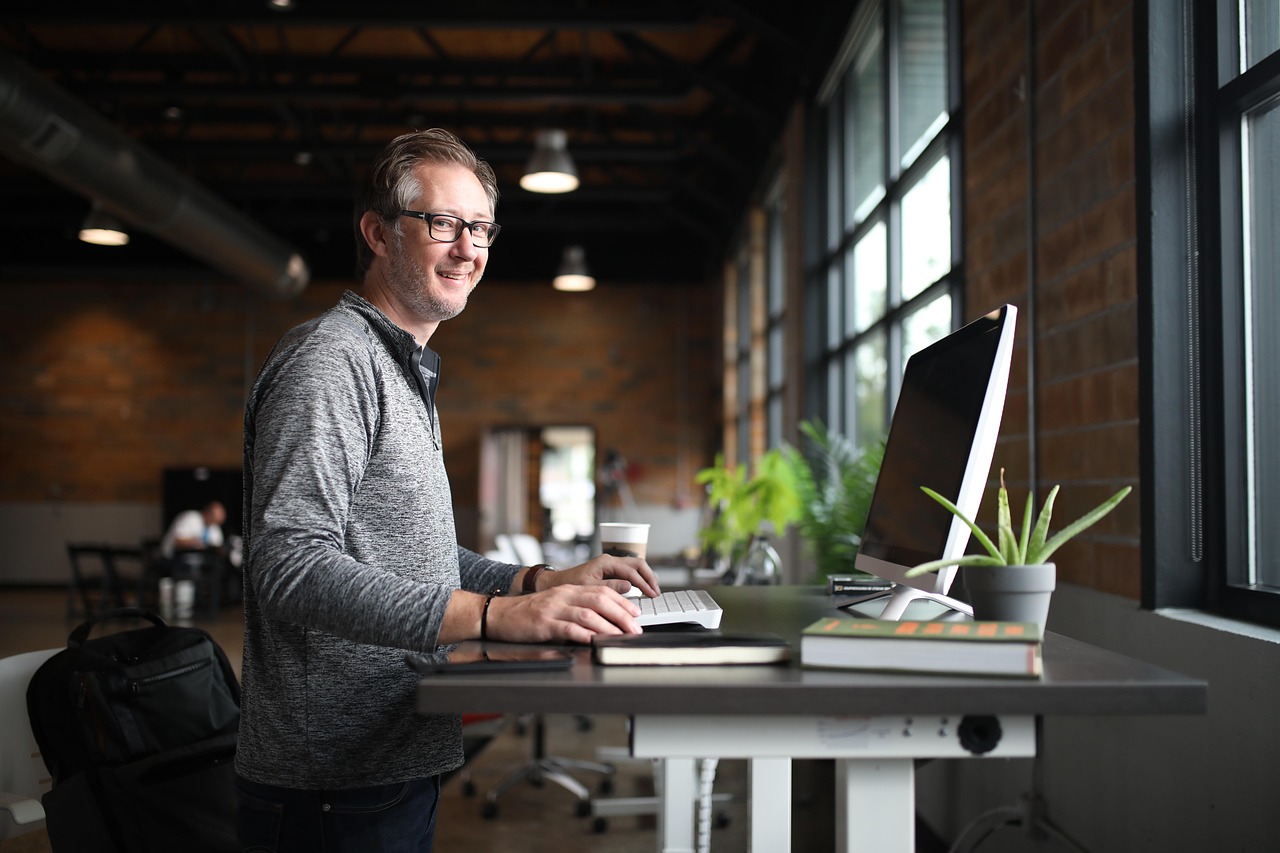 Office desk, man, business — Maximizing Efficiency with the Latest Asset Tracking Software Innovations