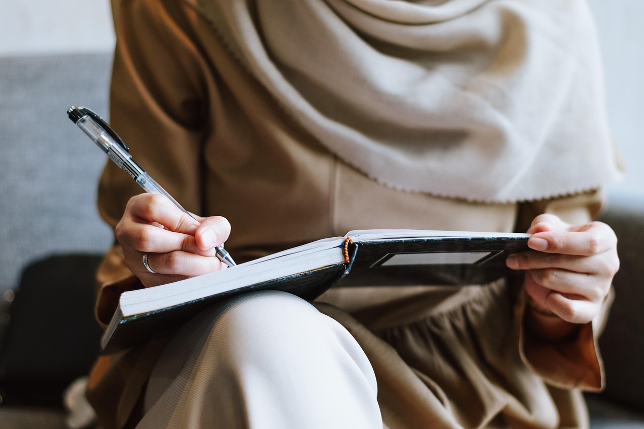 Muslim, woman, writing — Portable Train Horn: A Must-Have for Better Awareness